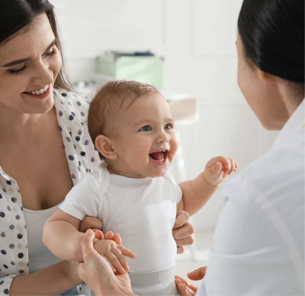 Mother with her cute baby visiting pediatrician in clinic